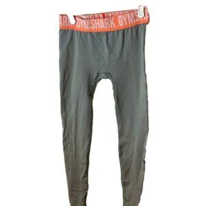 Size medium gymshark, gray seamless leggings with peach band